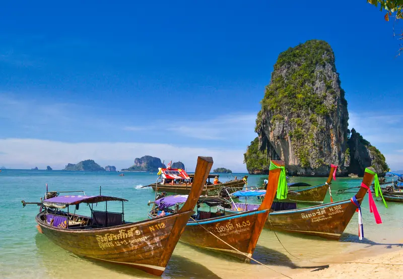 Longtail boats on a Krabi beach in Thailand