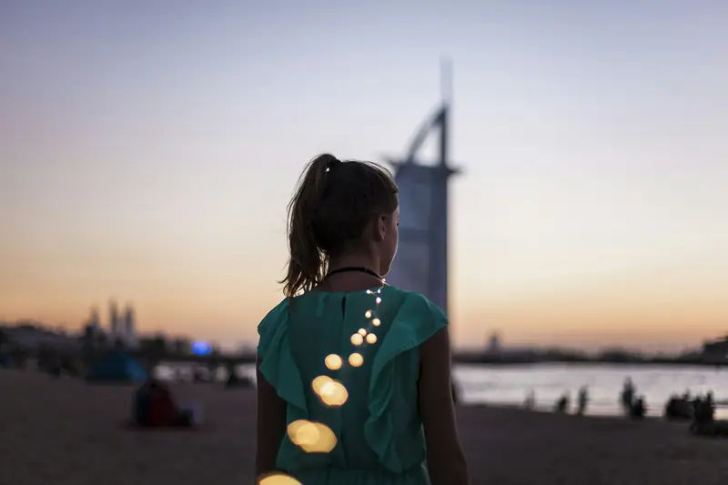 A traveller watching the sunset beside the Burj Al Arab